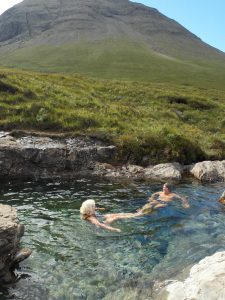 Relaxing in a fairy pool on the Isle of Skye